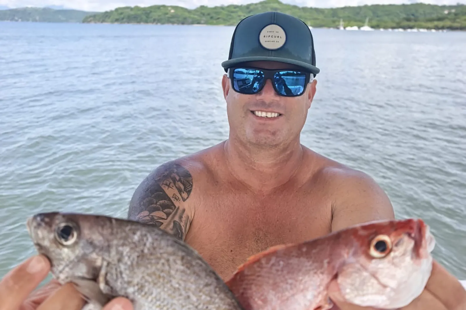 Captain Marcy holding two fish during the October 20 MarSea Tours trip