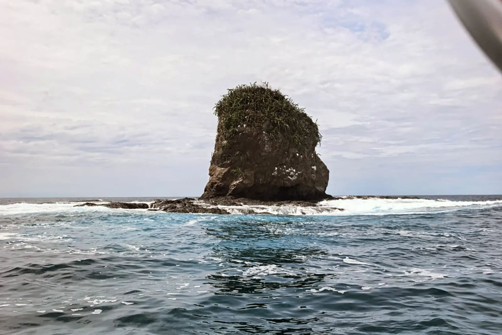 Monkey Head rock formation rising from the ocean in Papagayo