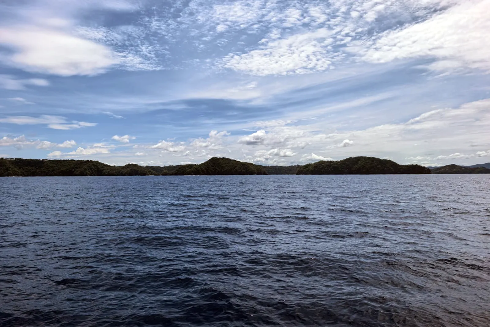 Calm water beneath blue skies in the Gulf of Papagayo